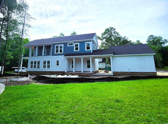 239 Madison Dr, Georgetown, SC 29440 - back of house with a yard, a shingled roof, board and batten siding, and covered porch