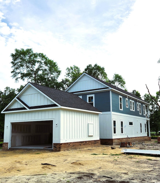239 Madison Dr, Georgetown, SC 29440 - view of front of home featuring board and batten siding and a shingled roof