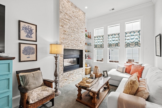 carpeted living room with crown molding and a fireplace