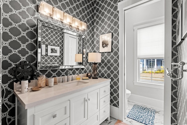 bathroom with vanity and toilet