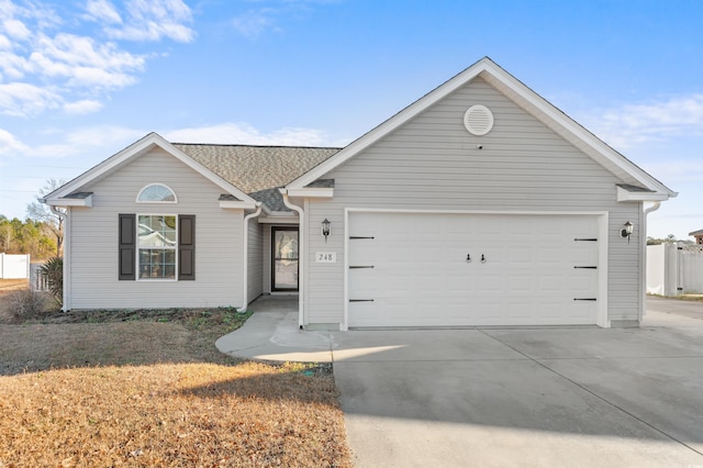 ranch-style house featuring a garage