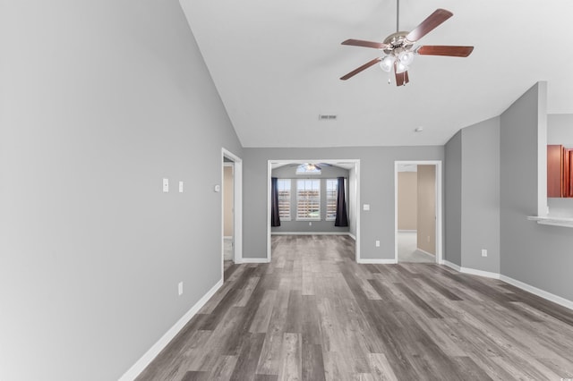 unfurnished living room with hardwood / wood-style flooring and lofted ceiling