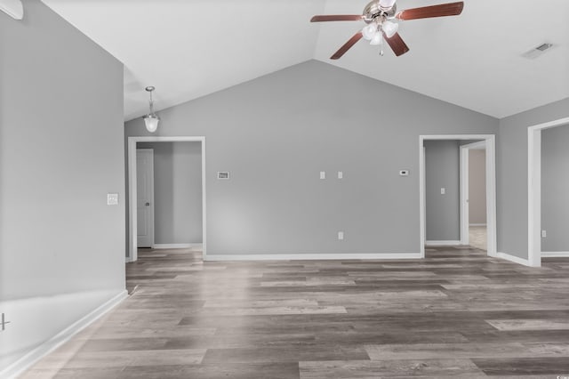 unfurnished living room featuring hardwood / wood-style floors, ceiling fan, and lofted ceiling