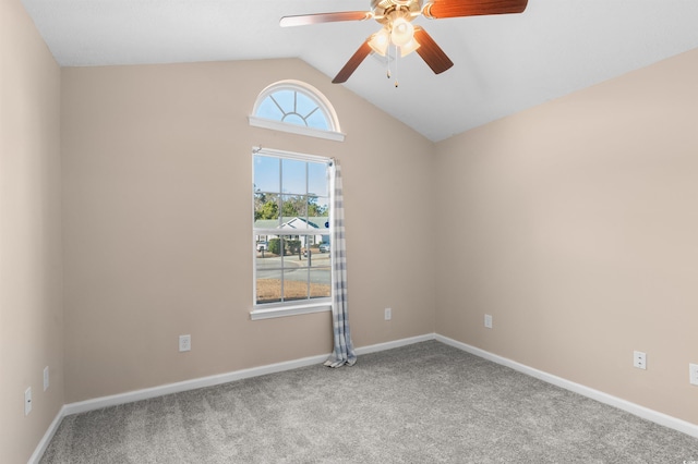 unfurnished room featuring ceiling fan, light carpet, and lofted ceiling