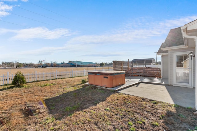 view of yard featuring a patio and a hot tub