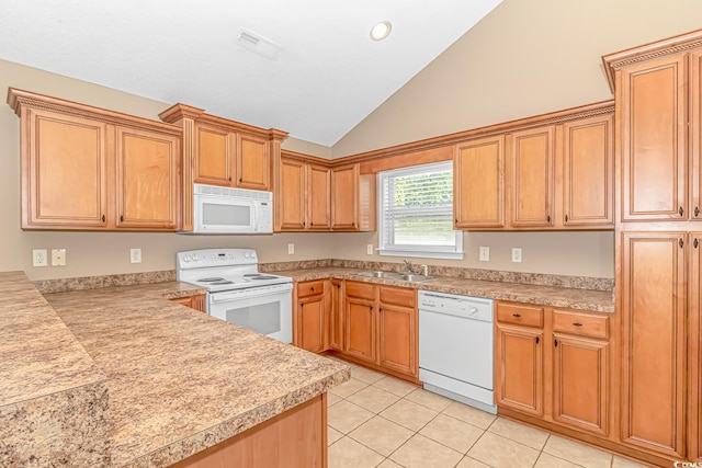 kitchen featuring light countertops, a sink, and white appliances