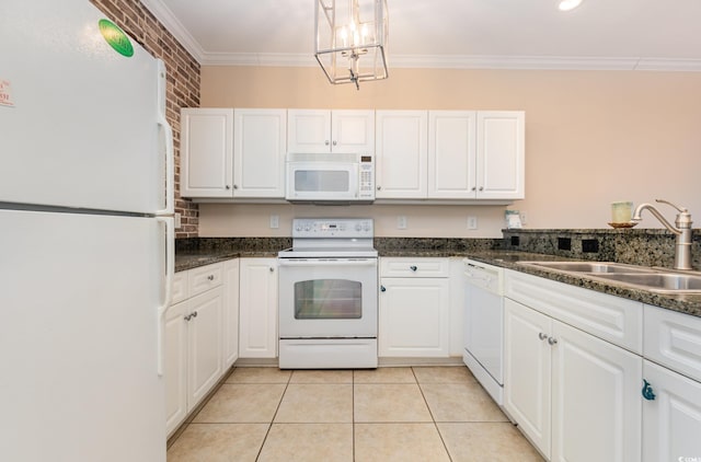 kitchen featuring white cabinetry, white appliances, sink, and brick wall