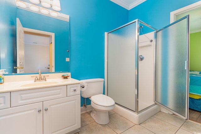 bathroom with tile patterned flooring, an enclosed shower, toilet, vanity, and ornamental molding