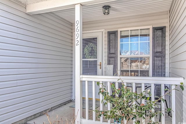 entrance to property featuring a porch