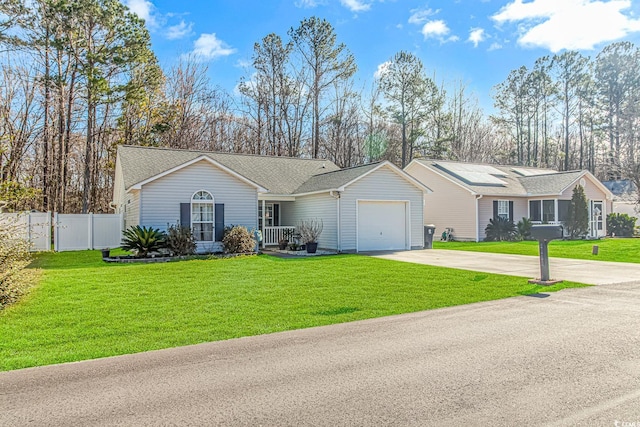 ranch-style home with a shingled roof, an attached garage, fence, driveway, and a front lawn