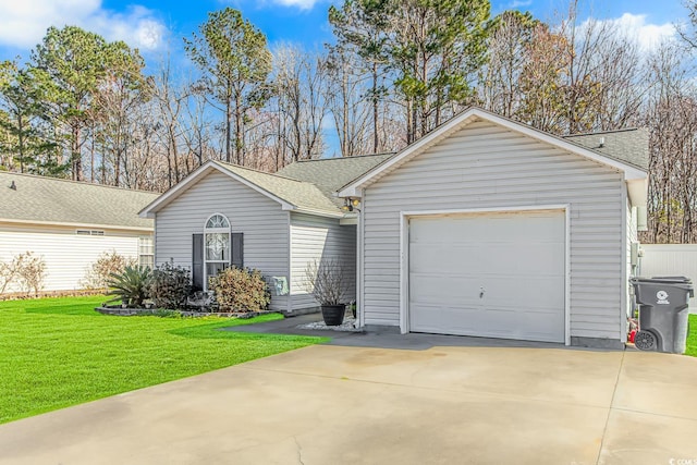 ranch-style home with a garage, a front yard, driveway, and a shingled roof