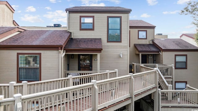 rear view of property with a wooden deck