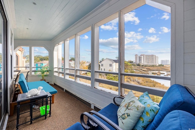 sunroom featuring wood ceiling