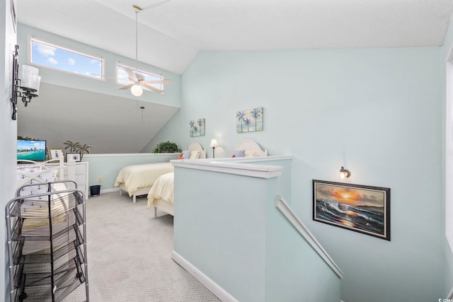 bedroom with light carpet, vaulted ceiling, and ceiling fan