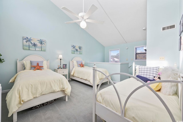 bedroom featuring carpet, ceiling fan, and vaulted ceiling