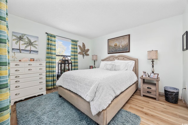 bedroom featuring hardwood / wood-style flooring