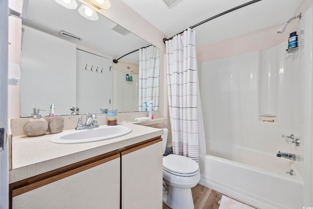 full bathroom with vanity, hardwood / wood-style flooring, toilet, and shower / bathtub combination with curtain