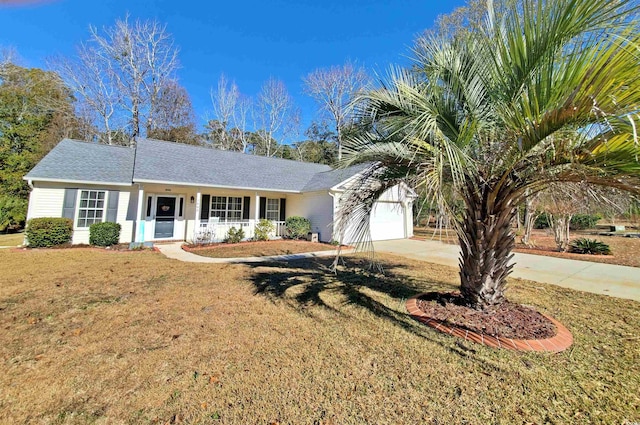 ranch-style house featuring a porch, a front yard, and a garage