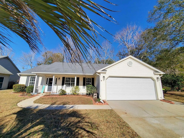 ranch-style house featuring covered porch, a garage, and a front lawn