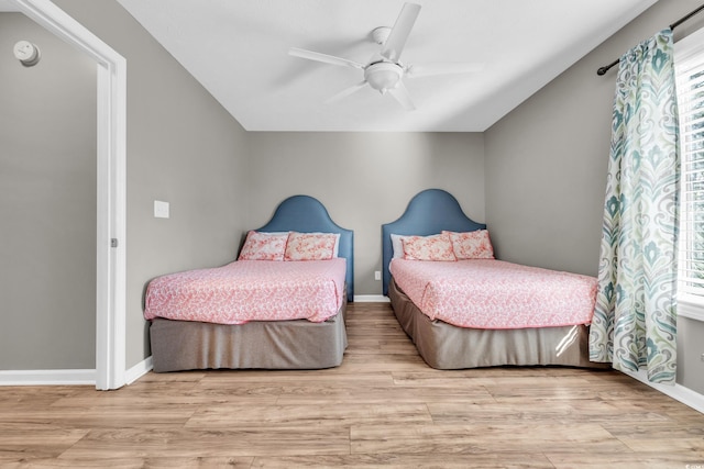 bedroom featuring light hardwood / wood-style floors and ceiling fan