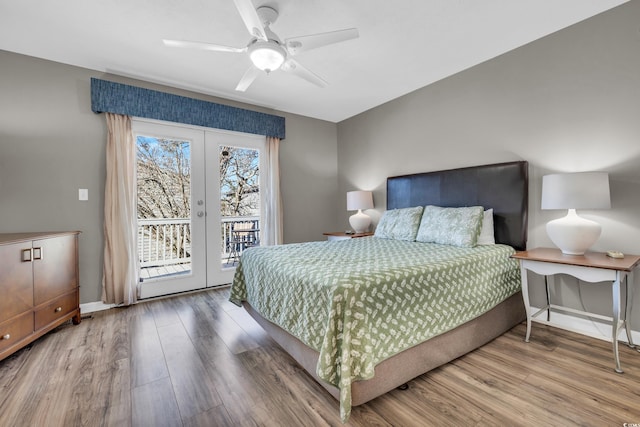 bedroom featuring access to exterior, ceiling fan, hardwood / wood-style floors, and french doors