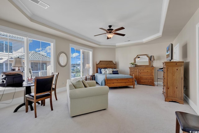 bedroom featuring crown molding, ceiling fan, carpet flooring, and a raised ceiling