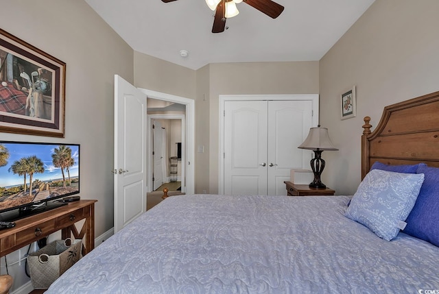 bedroom featuring ceiling fan and a closet