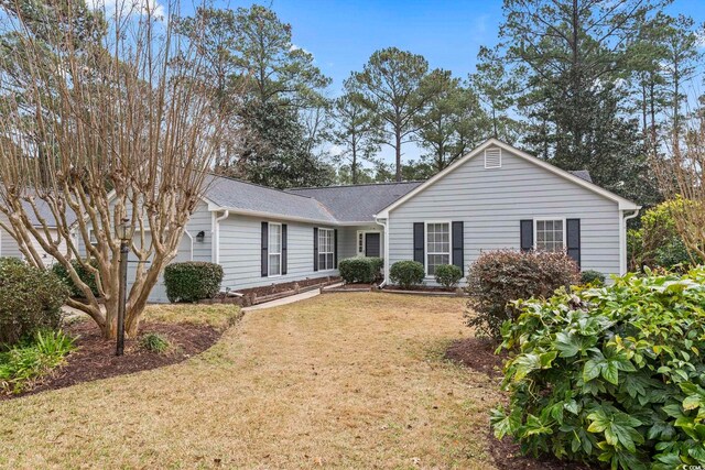 ranch-style home featuring a front lawn