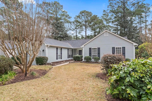 ranch-style home featuring a front yard