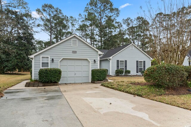 single story home featuring a garage