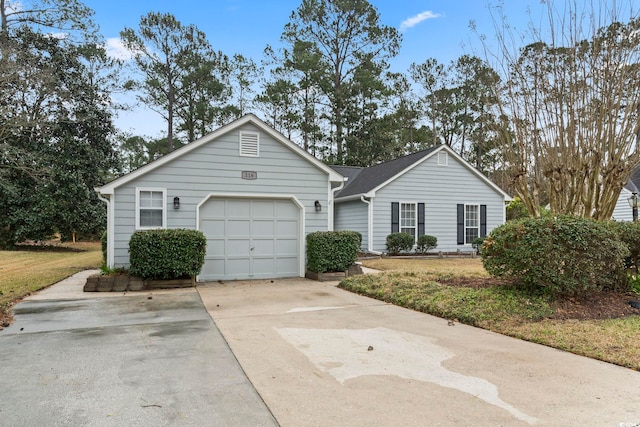 ranch-style house featuring a garage