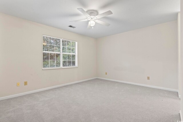 carpeted empty room with ceiling fan