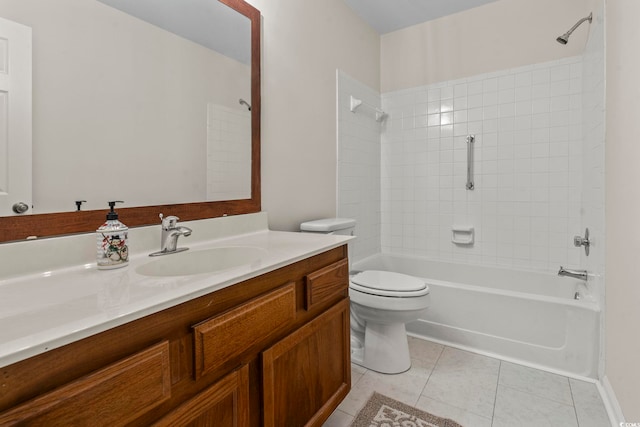 full bathroom with tile patterned flooring, tiled shower / bath, vanity, and toilet