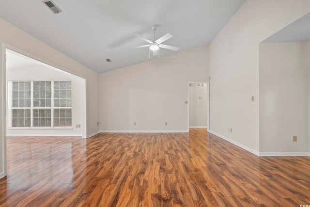 unfurnished room with ceiling fan, lofted ceiling, and wood-type flooring