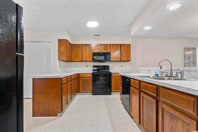 kitchen with sink and black appliances