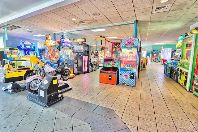 game room featuring a drop ceiling