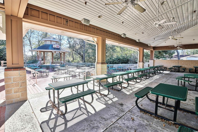 view of patio / terrace featuring a pool and ceiling fan