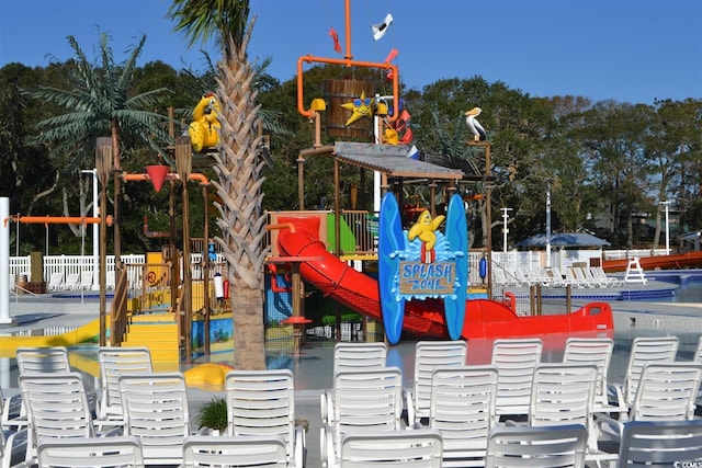 view of playground featuring fence