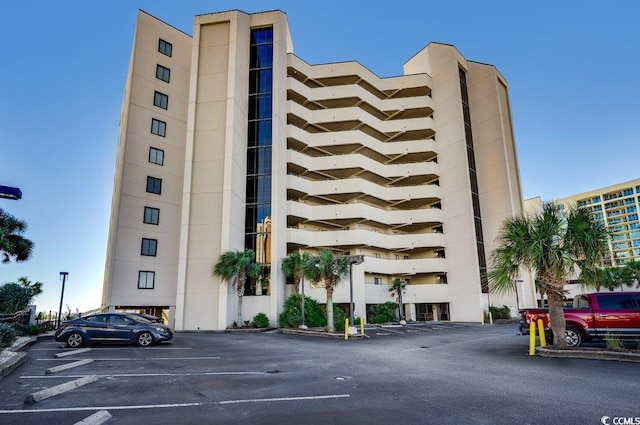 view of property with uncovered parking