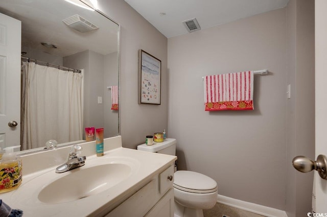 bathroom with toilet, baseboards, visible vents, and vanity