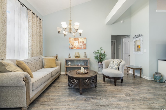 living room with a chandelier, hardwood / wood-style flooring, and lofted ceiling