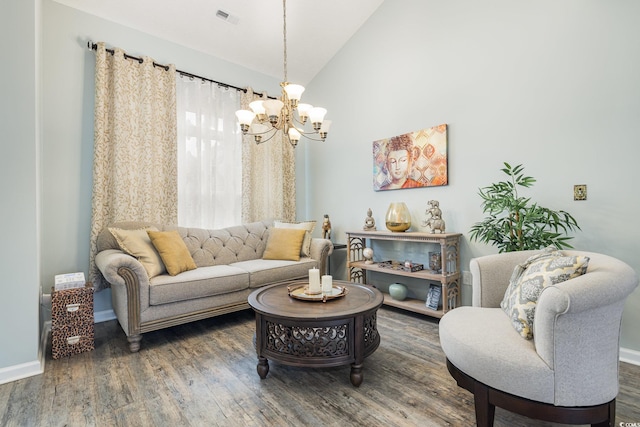 living room with lofted ceiling, an inviting chandelier, and dark wood-type flooring