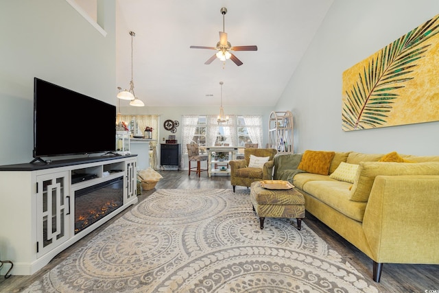 living room featuring hardwood / wood-style floors, ceiling fan, and high vaulted ceiling