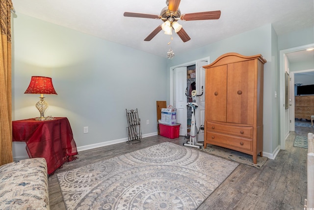 interior space with ceiling fan and dark wood-type flooring