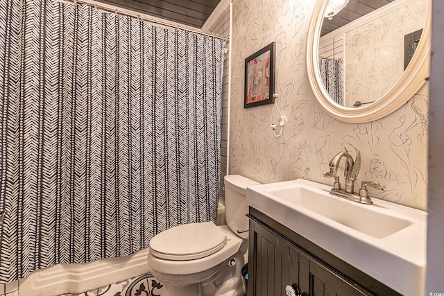 bathroom featuring toilet and vanity