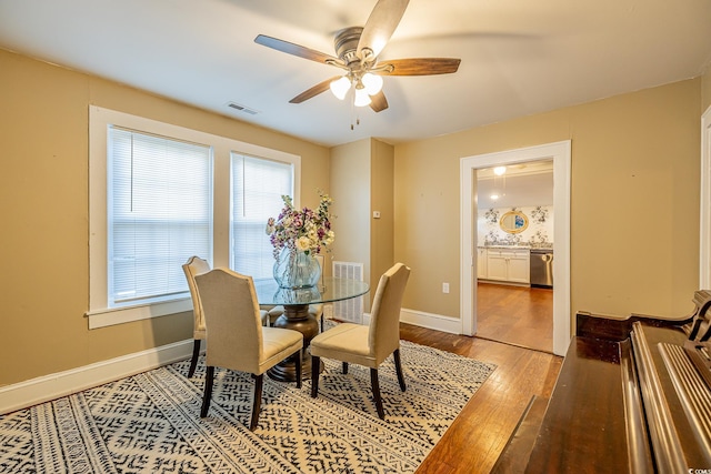 dining area featuring ceiling fan and hardwood / wood-style flooring