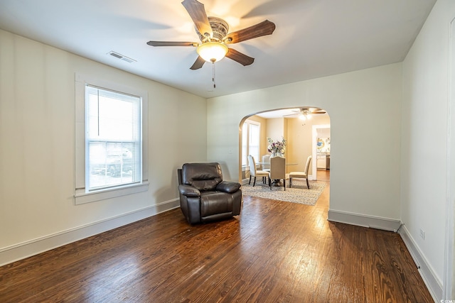 sitting room with ceiling fan and hardwood / wood-style floors