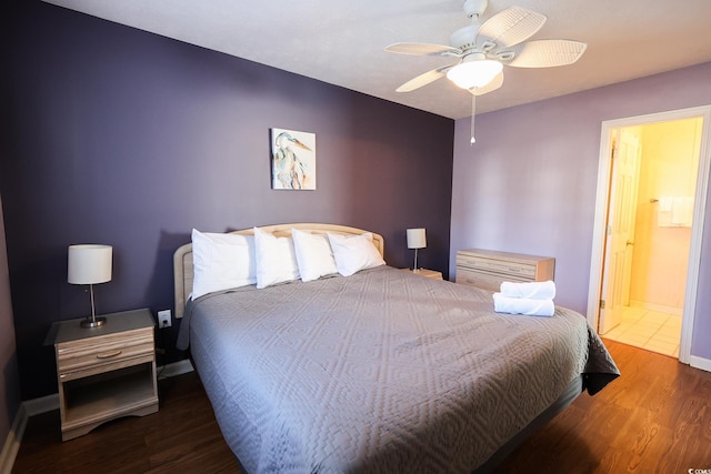 bedroom with dark hardwood / wood-style floors, ceiling fan, and ensuite bathroom