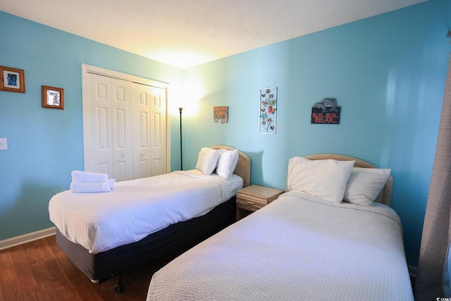 bedroom featuring a closet and dark hardwood / wood-style floors