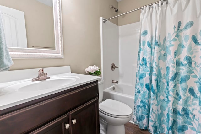 full bathroom with vanity, hardwood / wood-style flooring, shower / bath combination with curtain, and toilet